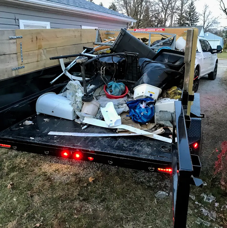 Roll-off dumpster delivered to a residential driveway in East Aurora
